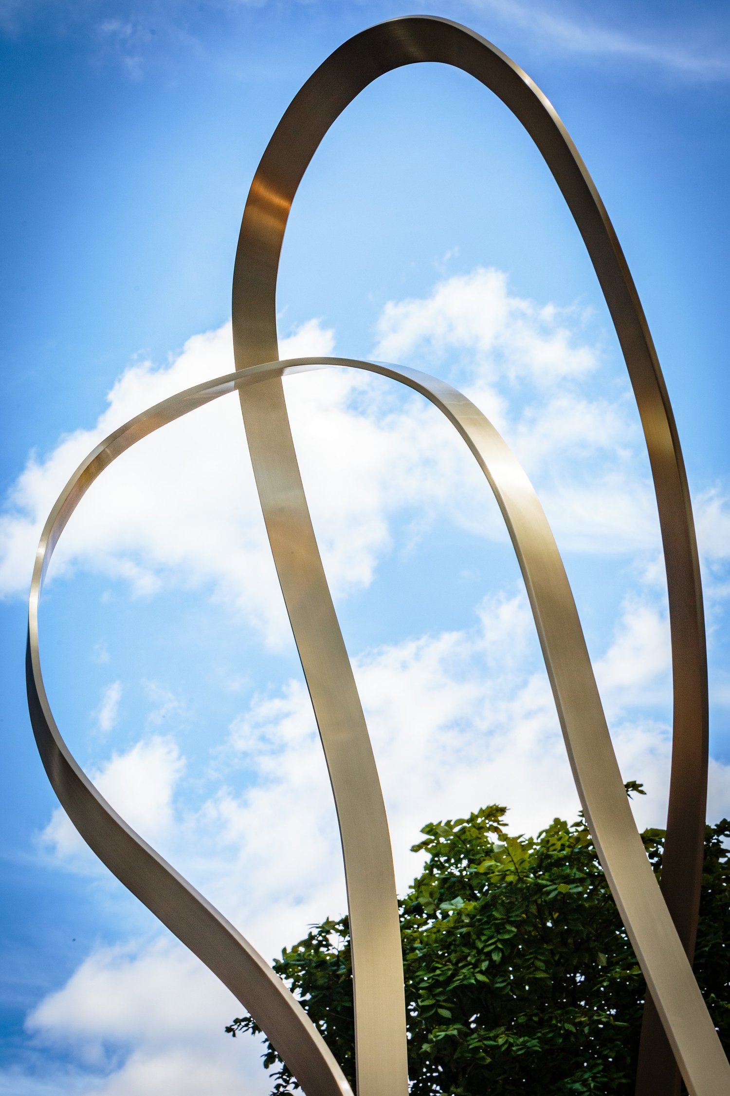 The Embrace · finished brass ribbons · Tony Turner